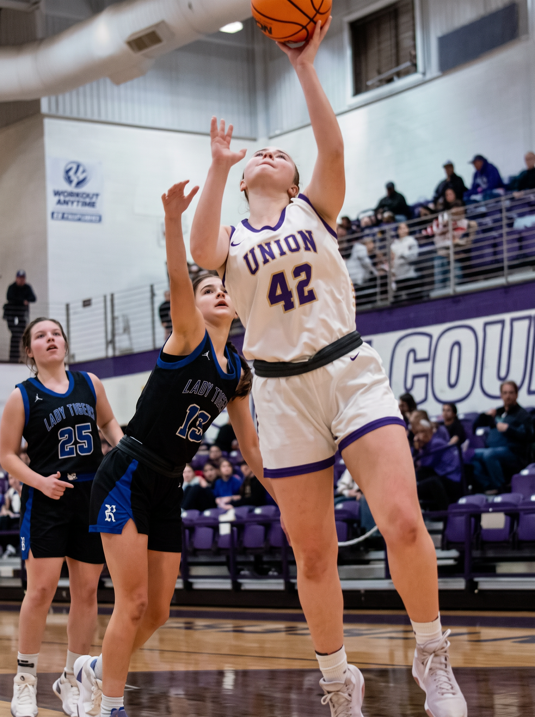McKenna G Hood #42 finishing a layup over a Lady Tigers defender for Union County